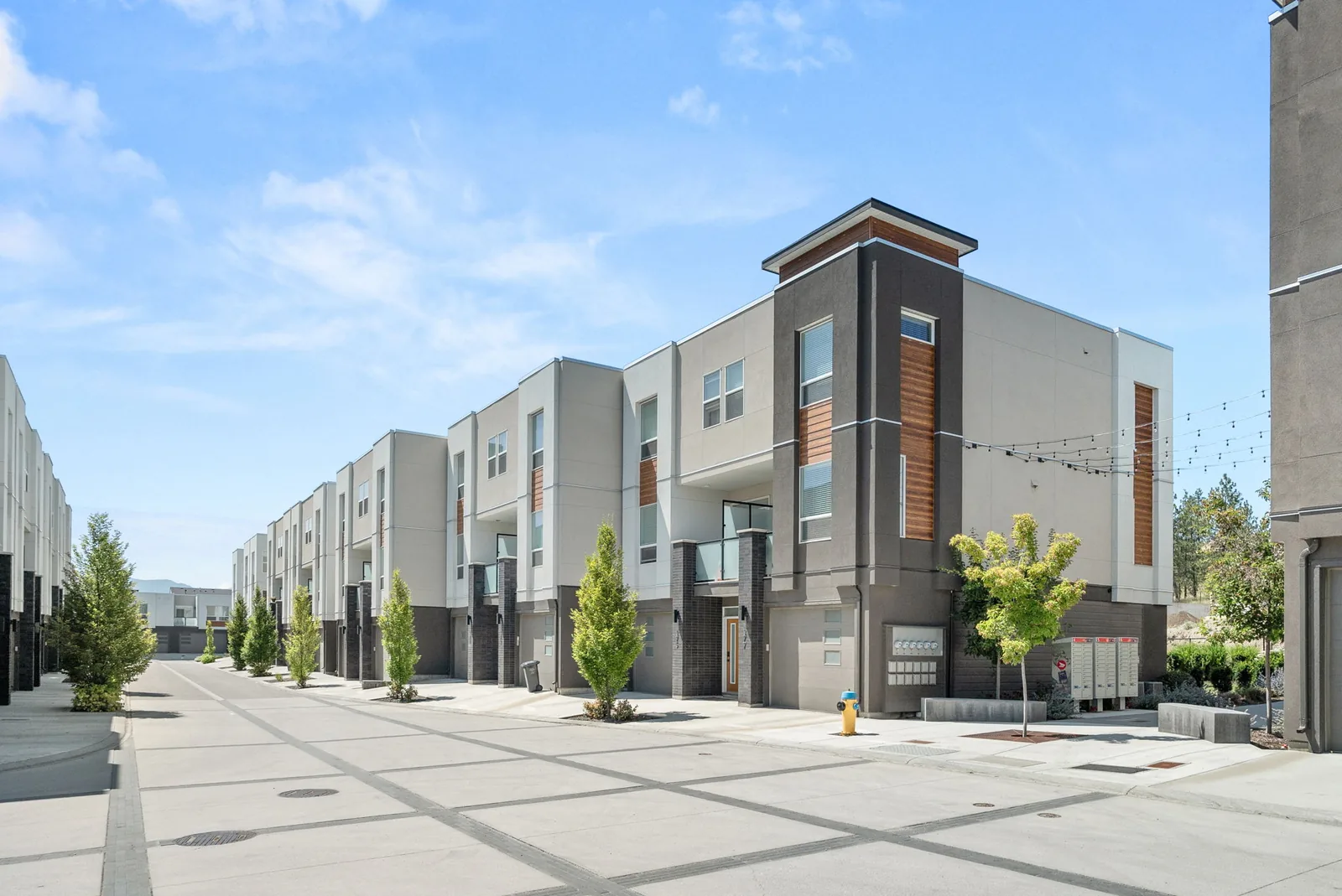 Academy Ridge townhomes along a tree-lined street