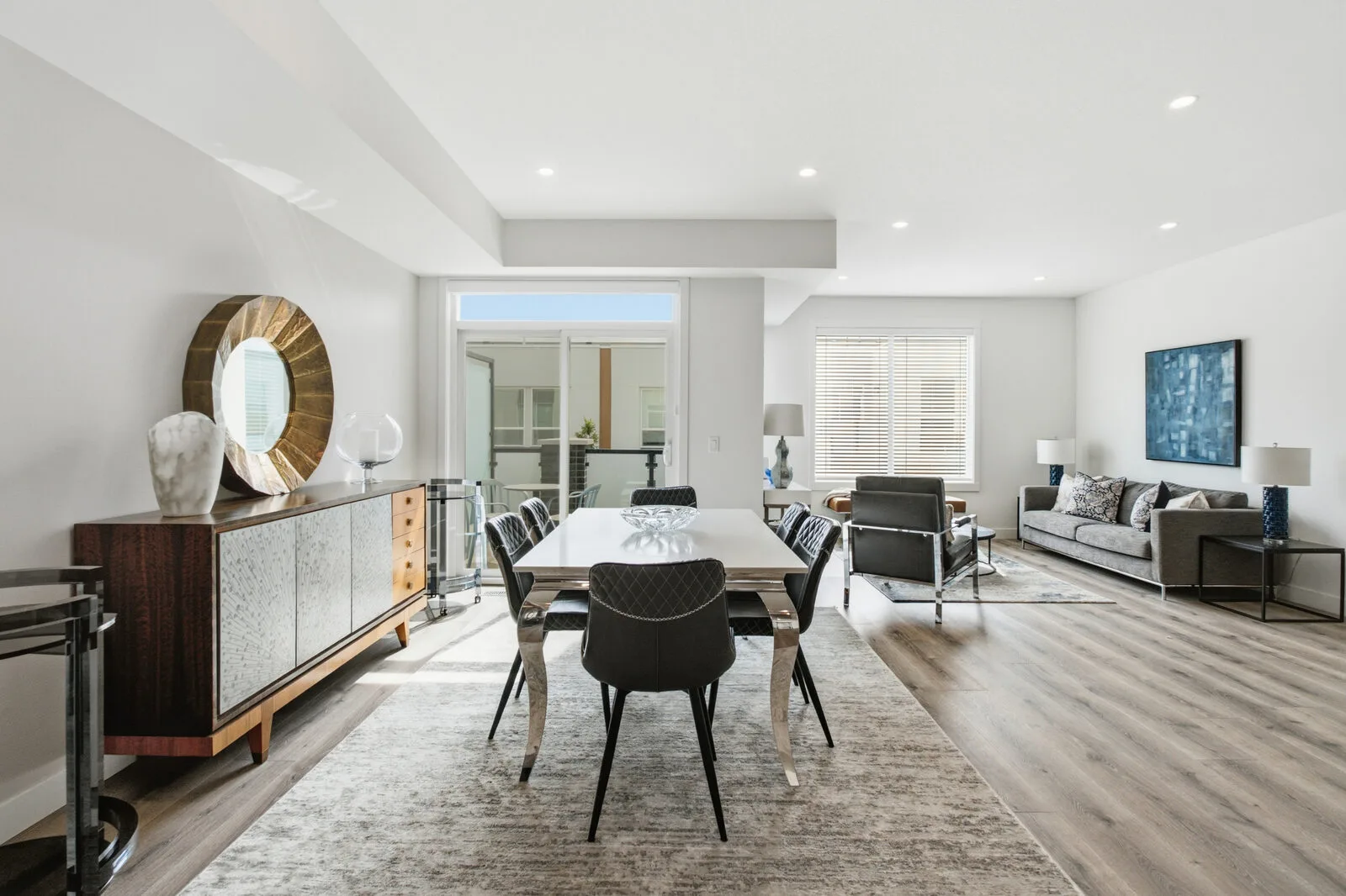 Dining area open to the living room in the Alpha show home