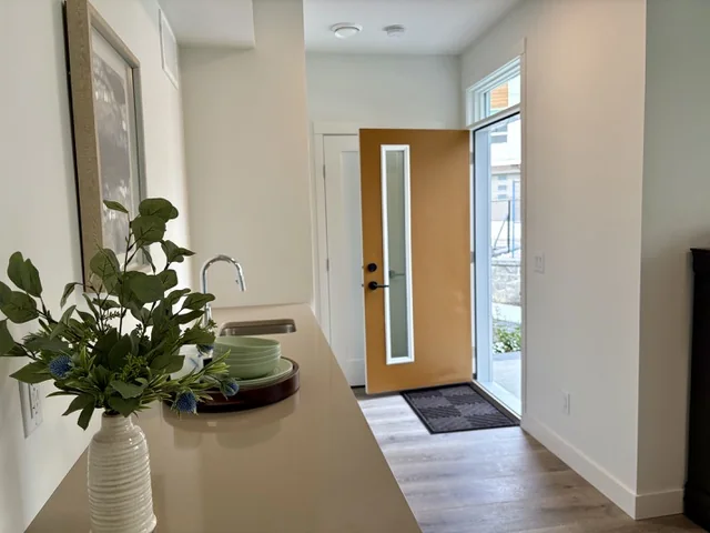Wet bar counter beside the separate exterior entrance of a lock-off flex room