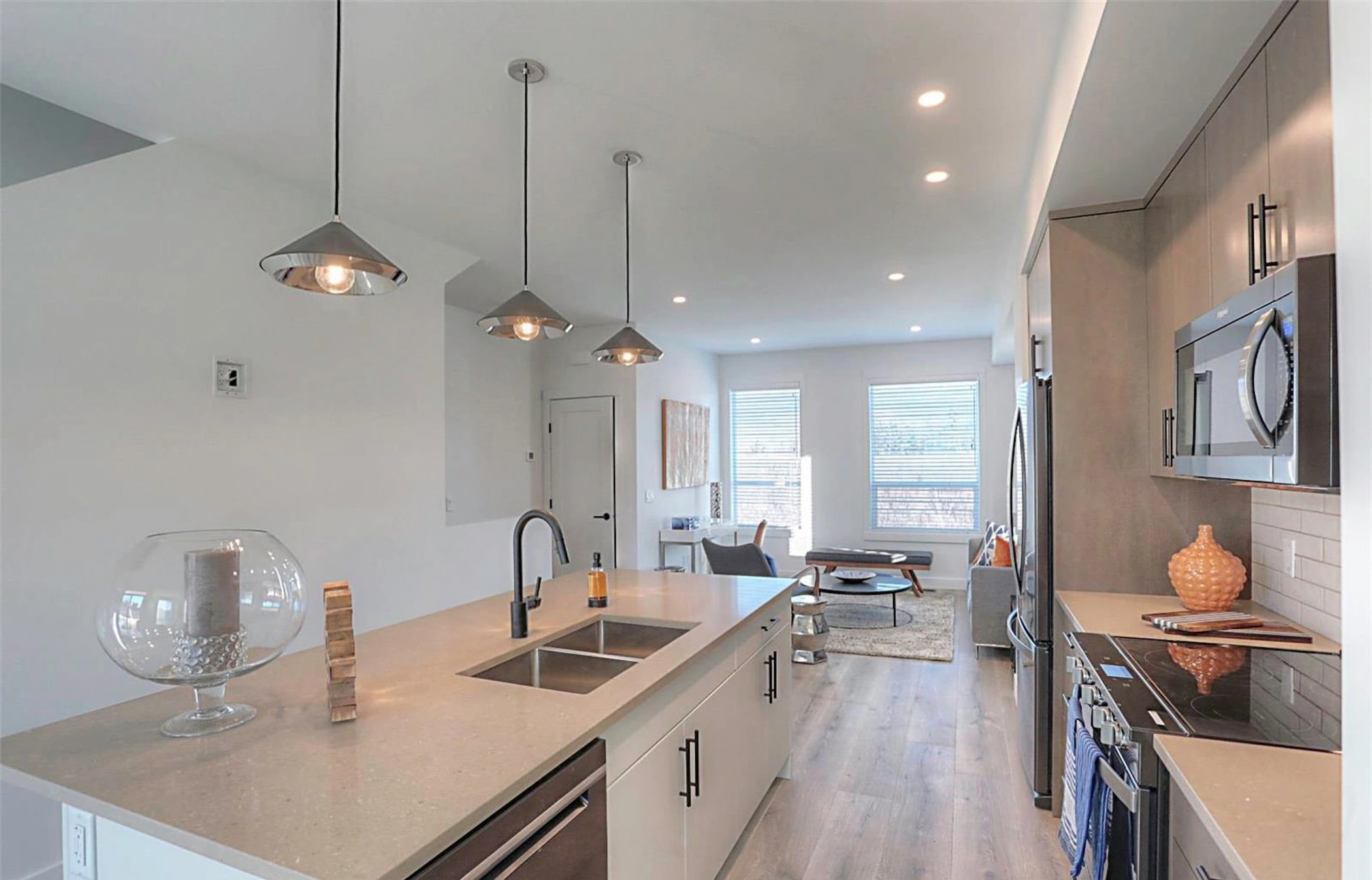 Kitchen island looking through to the living area in the Delta show home